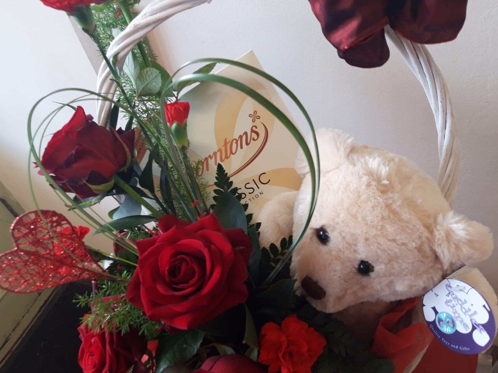 Chocolate teddy and flowers
