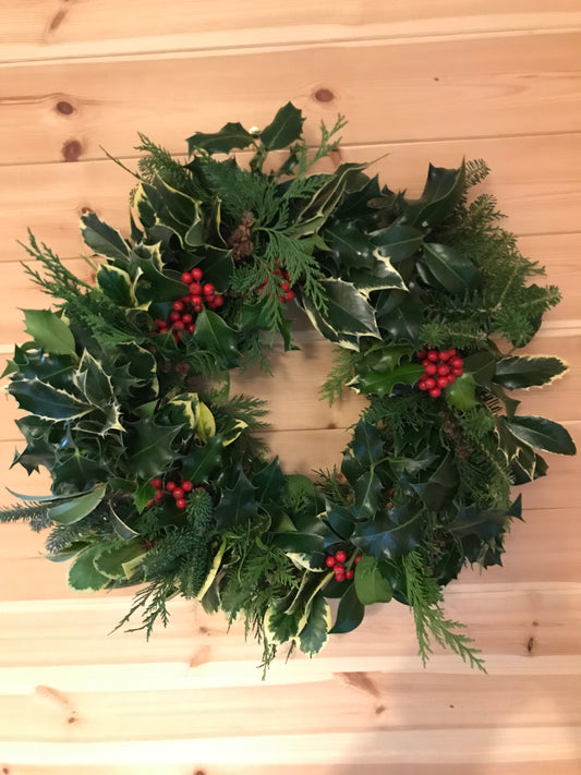 A traditional small Holly wreath