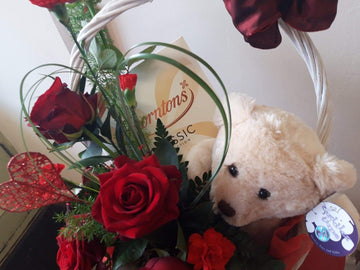 Chocolate, teddy and flowers.