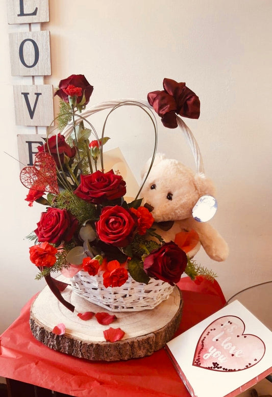 Chocolate, teddy and flowers.